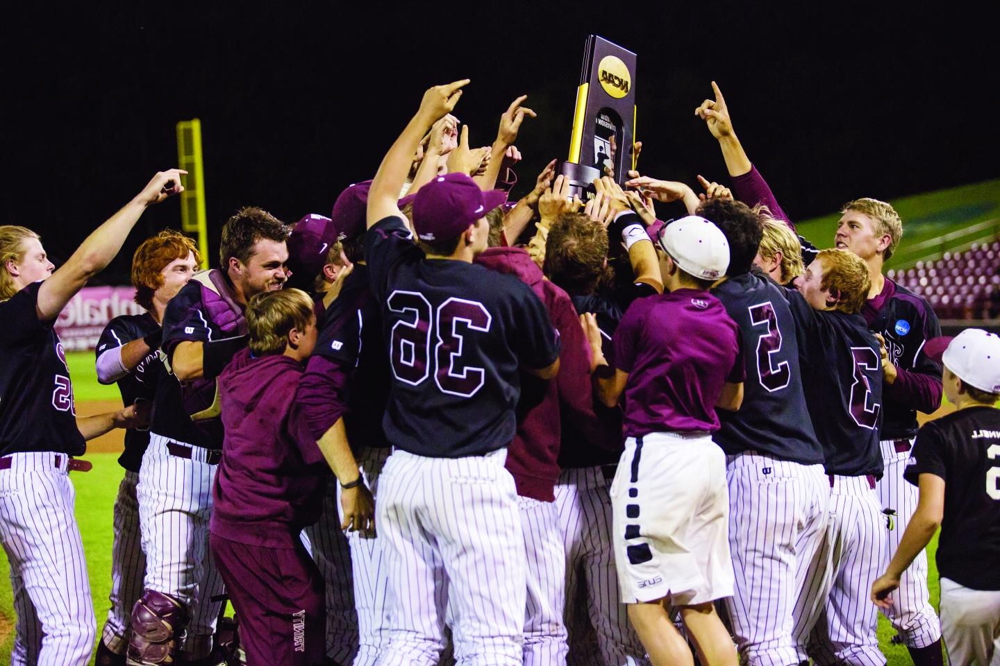 Trinity Baseball celebrates with the DIII National Championship trophy.